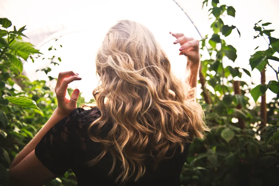 Blonde curls in golden light